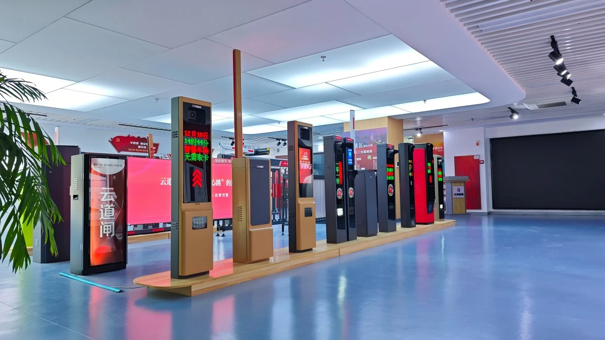 A range of parking barriers and access control terminals displayed in a showroom
